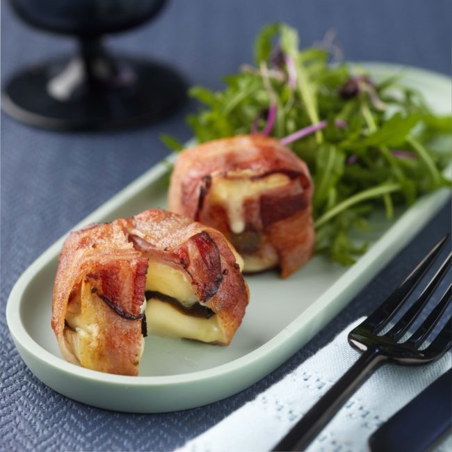 Bacon, prune and mini d’Affinois original cheese roulades with a rocket side salad -min